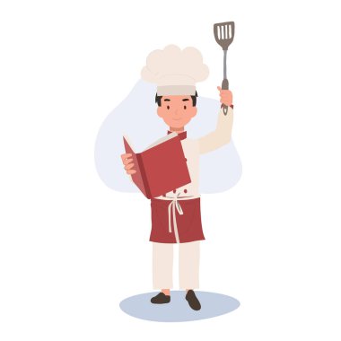 Genç aşçı aşçılık kitabı okuyor. Çocuk Aşçı Yemek Yapmayı Öğreniyor