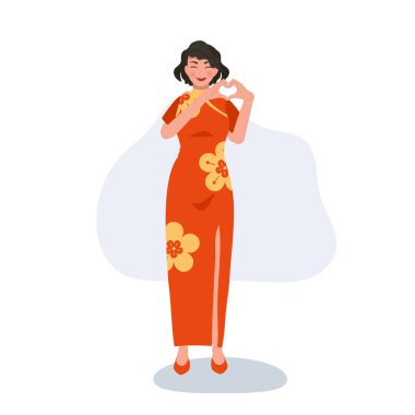 Şenlikli Çin Yeni Yılı konsepti. Sembolik kalbi olan kırmızı elbiseli, gülümseyen kadın el hareketi.