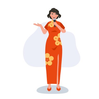 Kırmızı elbiseli, mikrofonlu neşeli Asya Modeli. Çin Yeni Yılı için Kültürel Zarafet