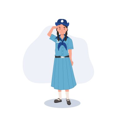 Taylandlı bir izci kız üniformasıyla disiplini ve onuru simgeleyen saygılı bir selam veriyor..