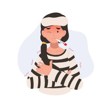 Yüksek ateş ve titreme geçiren bir kadın ateşini ölçmek için termometre kullanıyor..