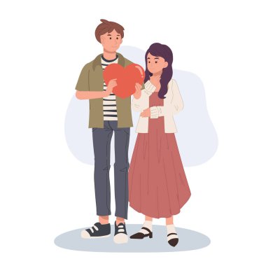 Aşk hediyesi sevgililer günü konsepti. Romantik an. Erkek kadına kalp verir.