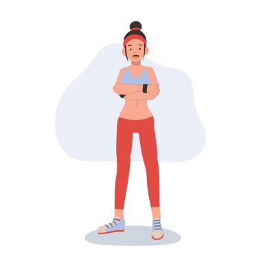 Spor kıyafetli atletik bir kadın spor motivasyonu ve beden eğitimi için özgüvenle poz veriyor.