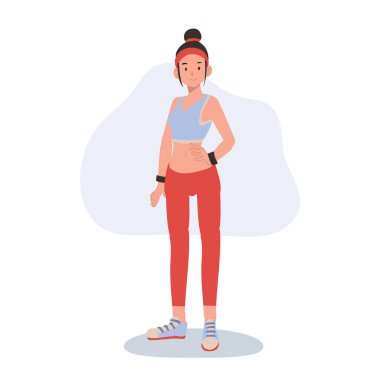 Spor kıyafetli atletik bir kadın spor motivasyonu ve beden eğitimi için özgüvenle poz veriyor.
