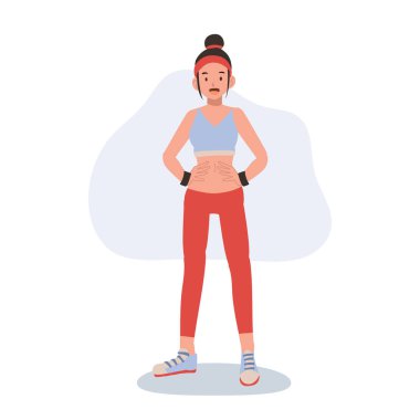 Spor kıyafetli atletik bir kadın spor motivasyonu ve beden eğitimi için özgüvenle poz veriyor.