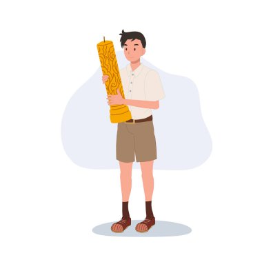 Tayland ve kültür festivali ve Asya geleneğinde Budist bayramı kutlaması için elinde büyük bir mum tutan thai öğrencisi..