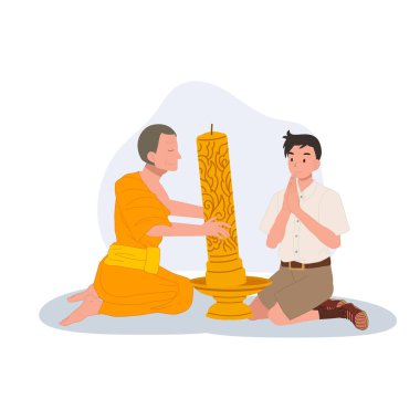 Genç bir Taylandlı öğrenci tapınaktaki Khao Phansa sırasında bir keşişe mum veriyor.