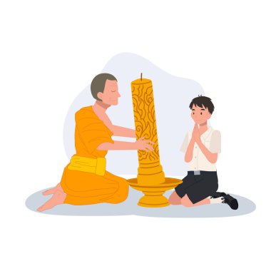 Genç bir Taylandlı öğrenci tapınaktaki Khao Phansa sırasında bir keşişe mum veriyor.