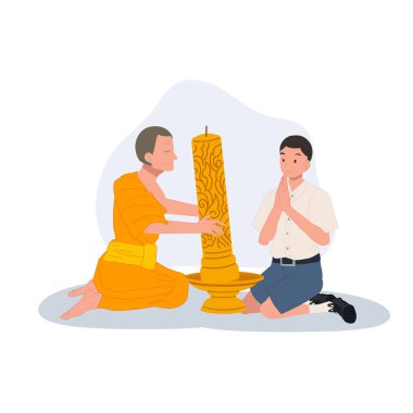 Genç bir Taylandlı öğrenci tapınaktaki Khao Phansa sırasında bir keşişe mum veriyor.