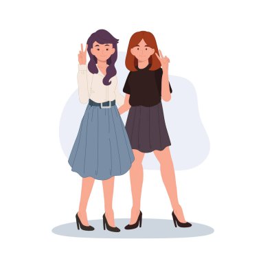 Barış işaretleriyle gülümseyen iki şık kadın.