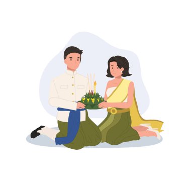 Thai Kültür Festivali sahnesi. Geleneksel giysiler içinde diz çökmüş bir çift, Tayland 'da Loy Krathong kutlaması için Krathong tutuyorlar.