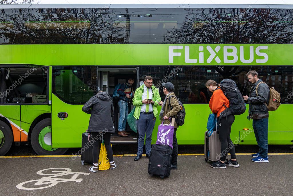 Copenhagen, Denmark  A driver of a long-distance bus company checks tickets from passengers boarding.