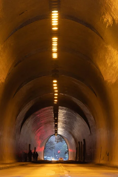 stock image Budapest, Hungary People walk through a car tunnel in Buda under the presidential palace, known as Buda Castle Tunnel.