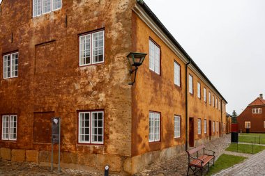 Helsingor, Denmark an orange ochre-colred house in the center of town. .