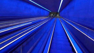 Copenhagen, Denmark The blue-lit escalator in the Gammel Strand Metro station.