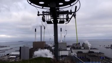 Copenhagen, Denmark A ski lift on top of Copenhill, a waste-to-energy power plant that doubles as a ski slope. 