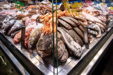 Copenhagen, Denmark J Fresh fish on display at the fancy Torvehallerne food market and Dansih signs and prices.