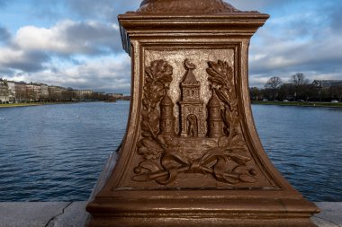 Copenhagen, Denmark A detail of a lamp post on the Queen Louise Bridge showing the three orginal towers of the city.