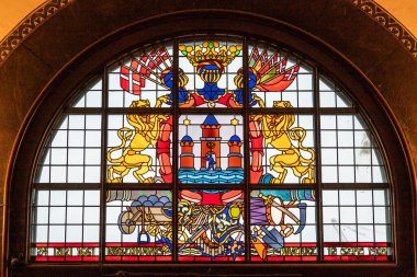 Copenhagen, Denmark A stained glass window in the main hallway of the  Copenhagen City Hall represneting the three original towers of the city.