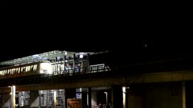 Copenhagen, Denmark A Metro train on the M1 line at the DR-Byen Metro station at night. 