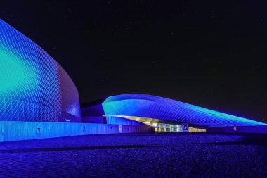 Copenhagen, Denmark  The Blue Lagoon, Denmark National Aquarium building at night.