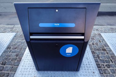 Copenhagen, Denmark  Modern and clean garbage collection, sorting and seperation bins on a street in the Amager district.Sign says paper in Danish.