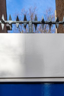 Delf, Netherlands Metal spikes on top of a residential doorway.