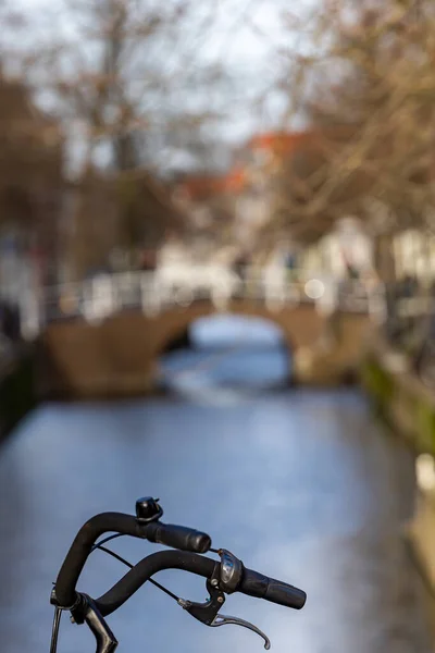 Delf, Netherlands Bicycle handlebars and canal