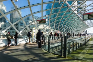 The Hague, Netherlands, People on the platform and the modern interior of The Hague central station.