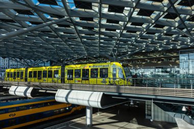 The Hague, Netherlands, The modern interior of The Hague central station and a tram.