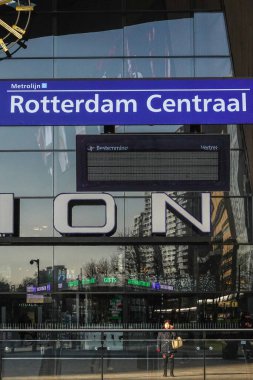 Rotterdam, Netherlands A woman stands outside the Rotterdam Central Station.