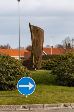 Bronderslev, Denmark An arrow sign on  roundabout on a road