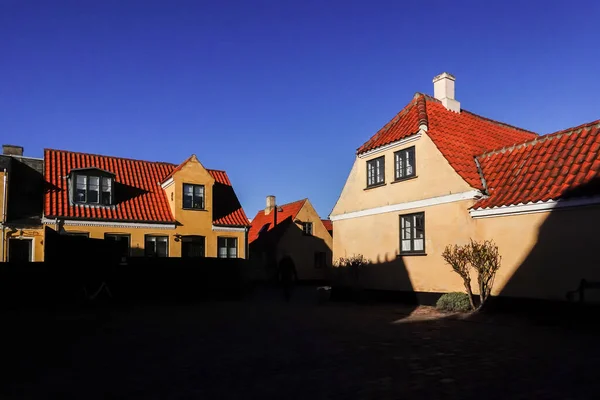 Dragor, Denmark  Strong shadows on a picturesque square in Dragor with tradiotnal houses.