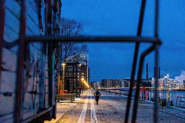 stock image Copenhagen, Denmark An old train wagon on the Islandsbrygge waterfront and a jogger.