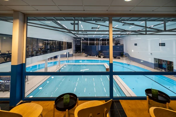 stock image Copenhagen, Denmark An inside view of the DGI-byen Aquatic Centre public pool with a circular pool.