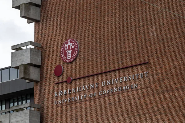 stock image Copenhagen, Denmark A sign on a brick building for the University of Copenhagen.