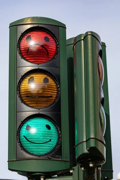 Copenhagen, Denmark Traffic lights with painted faces. Green for Happy. Red for sad.