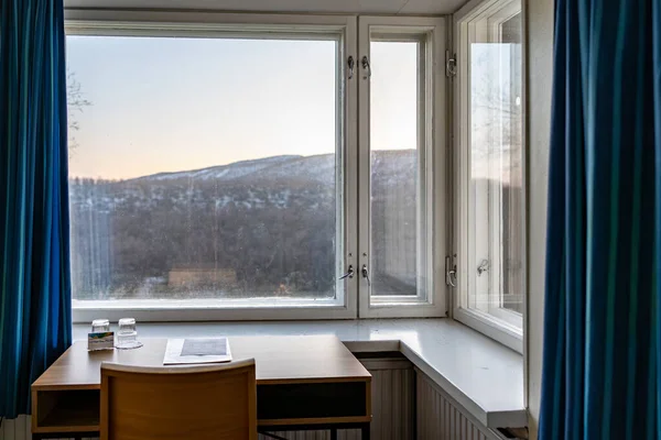 Utsjoki, Finland A small hotel room with a view over the mountains.
