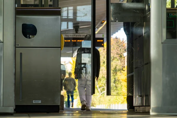 stock image Stockholm, Sweden Oct 19, 2023 People passing through the turnstiles at the Blasut Tunnelbana or metro station.