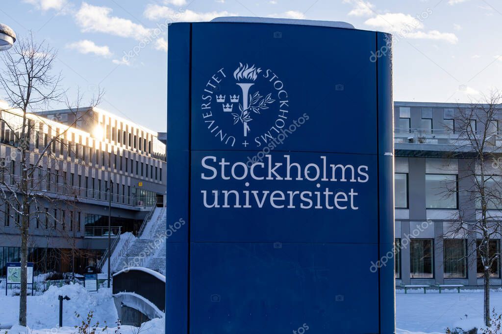 Stockholm, Sweden Dec 27, 2023 An exterior sign in Swedish for the Stockholm University in wintertime in the snow.