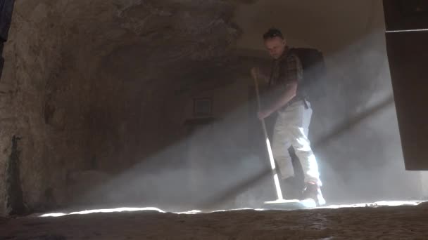 Roccamorice Italy Man Sweeps Dirt Floor Eremo San Bartolomeo Sanctuary — Stock Video