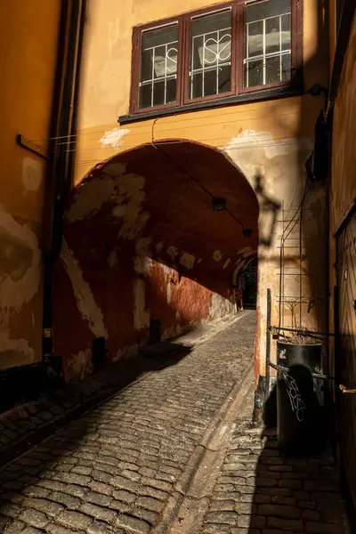 Stockholm, Sweden The  strong afternoon sun on the medieval alley  Gasgrand in the Old Town.