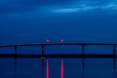 Solomons, Maryland USA The Governor Thomas Johnson Bridge over the Patuxent River at night. clipart