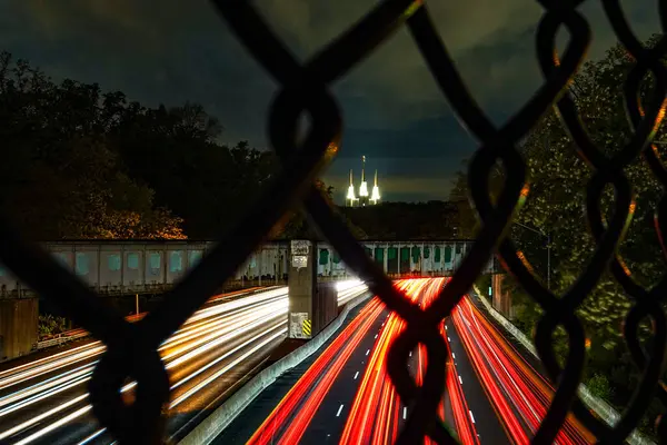 stock image Washington DC USA Traffic on the Interstate 495 Beltway at night and the Washington D.C. Temple, or Mormon Temple.