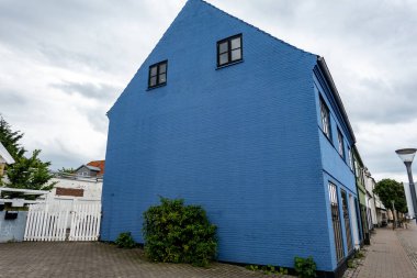 Hundested, Denmark The facade of a blue building on the main street. clipart