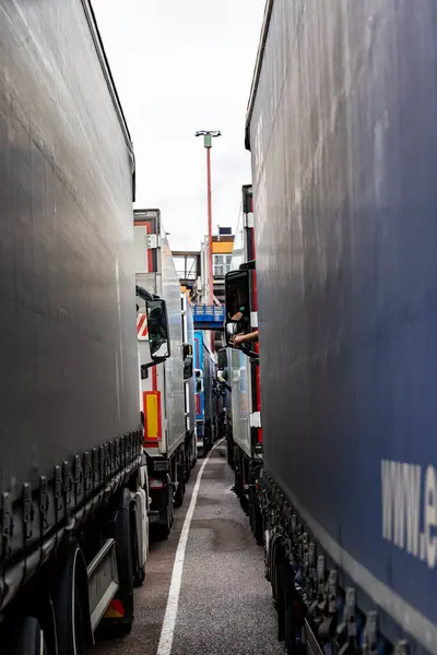 stock image Gothenburg, Sweden June 30, 2024 Trucks parked inside a Stena Line passenger and car ferry going to Denmark and a truck driver.