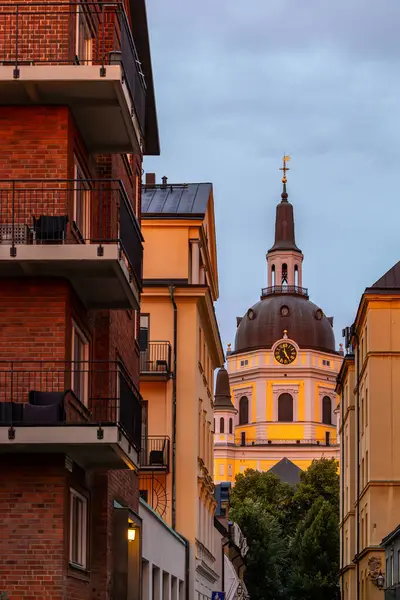 stock image Stockholm, Sweden Aug 14, 2024 Residential buildings on the island of Sodermalm contrast with the Katarina Church in the morning light.