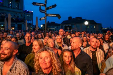 Stockholm, Sweden August 20, 2024 Swedish public at an outdoor concert at Sodra Teatern at Mosebacke. clipart