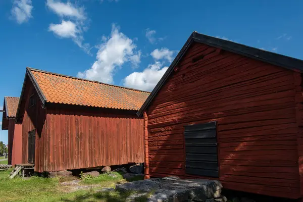 stock image Osthammar, Sweden Traditional red wooden barns and sky.