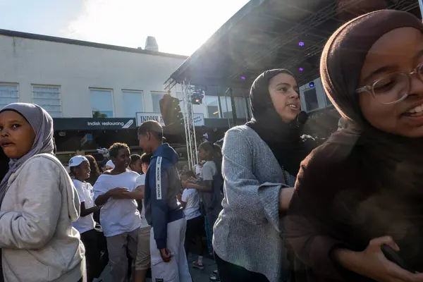 stock image Stockholm, Sweden Aug. 24, 2024 People enjoying the outdoor summer Rinkeby festival in the Rinkeby suburb with food trucks and live music.